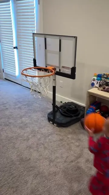 Can your kid hang upside down on the basketball hoop you have? Mine can! #basket