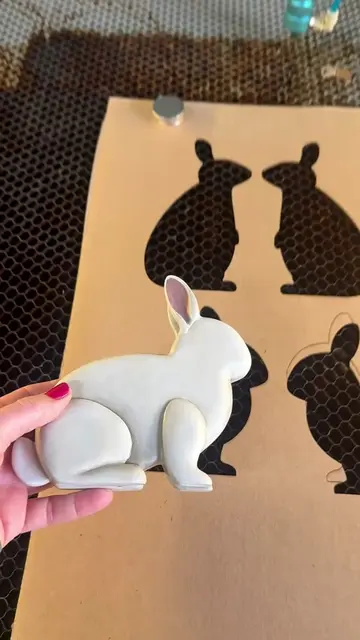 Cardboard jig for the last little details on these bunnies. #lasercutting #sprin