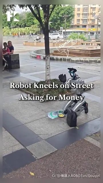 A robot was seen kneeling on a street in China, asking for money using a WeChat 