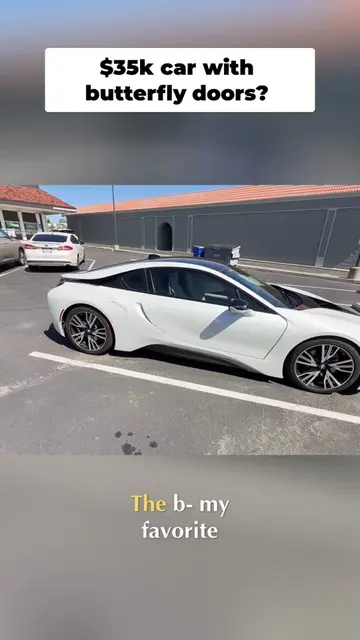 Experience the future of driving with this hybrid BMW i8. Featuring stunning but