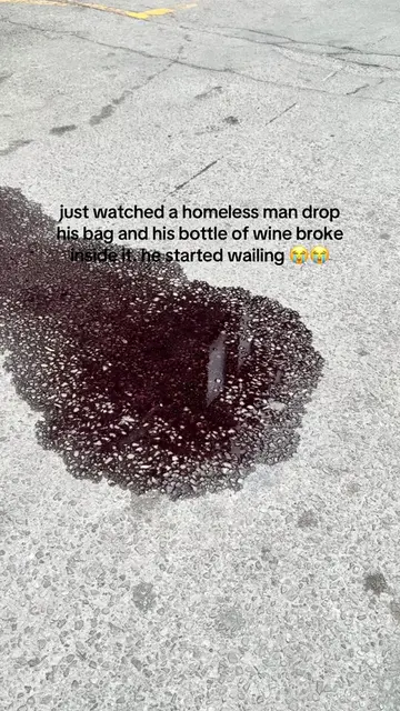 He was carrying one bag and dropped it as he passed by. The bottle of wine insid
