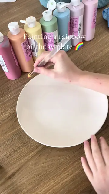 A rainbow birthday plate in the making 🌈🎨 Each one is hand painted and kiln fi