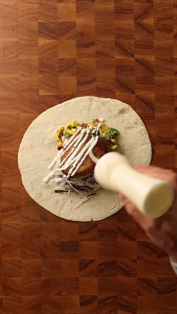 fried fish burrito with mango peach salsa