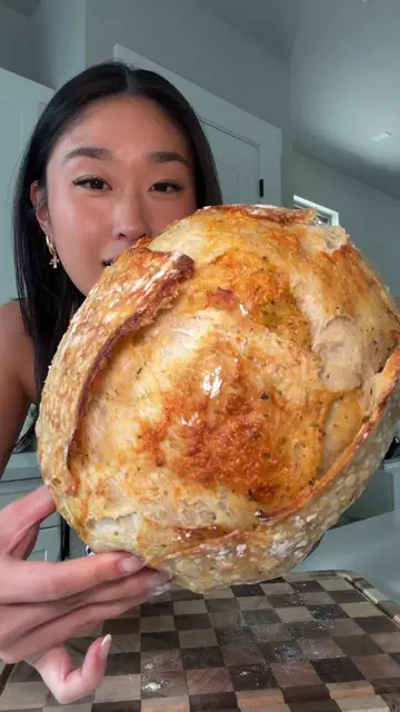 Cut open my Italian herbs and cheese sourdough bread 🔪🍞🤤 recipe coming soon!!