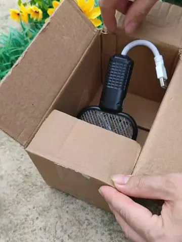 Mini electric mosquito swatter with blue light for attracting mosquitoes. #fyp #
