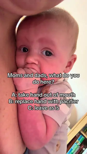Moms and dads, what do you do here for your 3 month old baby? A: take hand out o