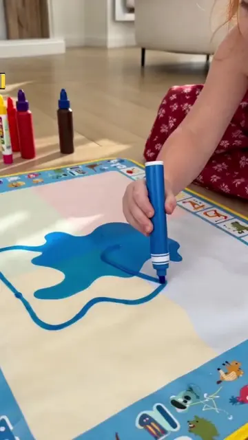 The water mat made mess-free drawing look suspiciously fun #WaterDrawingMat #Mes