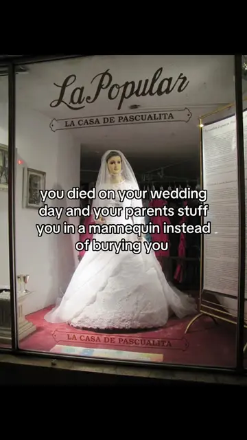 she is not a wax doll, but the corpse of the shop owner's daughter, who tragical