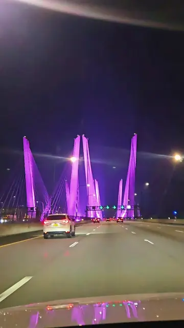 Cruising through the night as the Governor Mario M. Cuomo Bridge lights up the H