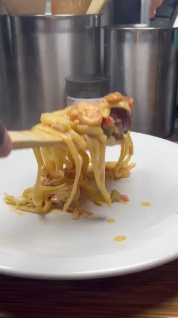 Mardi Gras Pasta Ingredients: •	2 tablespoons olive oil •	1 sausage link, sliced