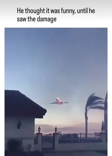 The video shows a homeowner filming an aerial drop of red Phos-Chek fire retarda