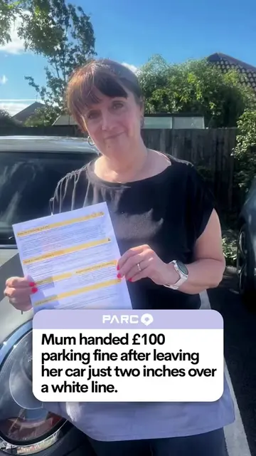 A mum was handed a £100 parking fine for being just two inches over a white line