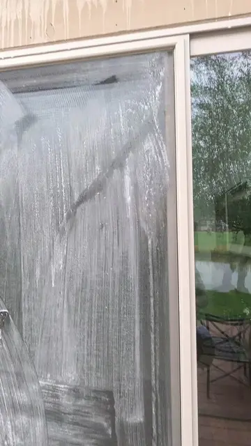 Mopped the screen door down, wiped it with a rag, and cleaned up the excess befo