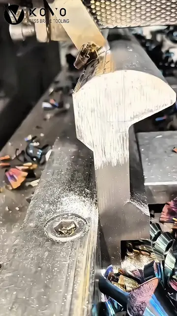 Arc die in progress - contour just roughed out, surface still raw. Spindle at fu