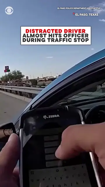 A distracted driver in El Paso narrowly avoided hitting a police officer during 