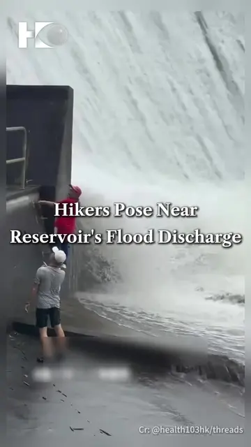Two hikers were spotted posing for photos near a flood discharge at Ho Pui Reser