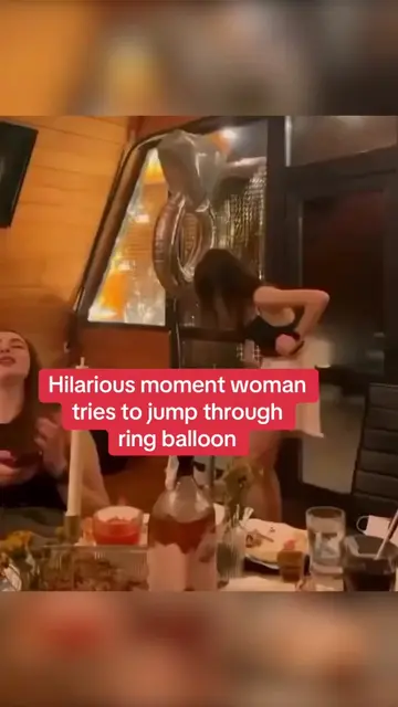 This is the hilarious moment a woman tries to jump through a ring balloon. #vira