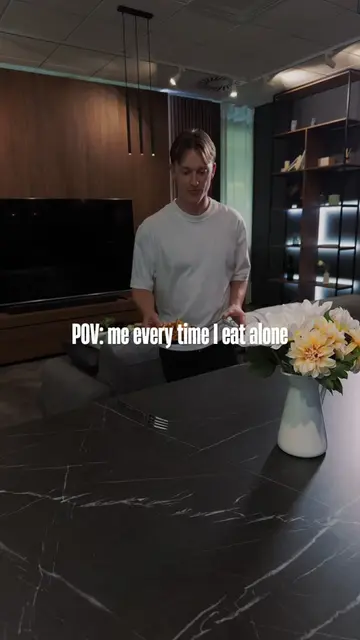 Eating alone means building a full phone stand out of anything nearby 📱🍽️ What