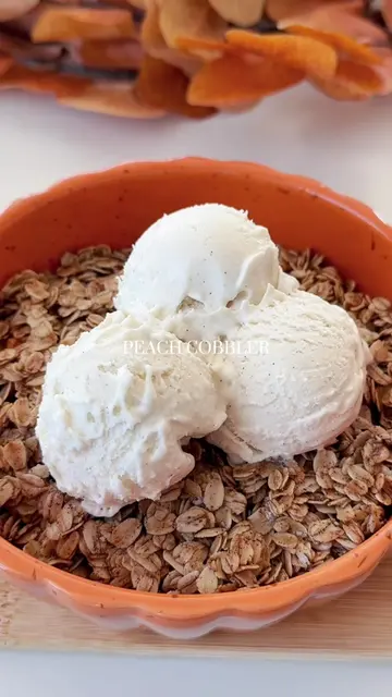Cozy Fall Peach Cobbler 🍑🍁🤤 Recipe: 2 sliced peaches Coat in cinnamon and hon