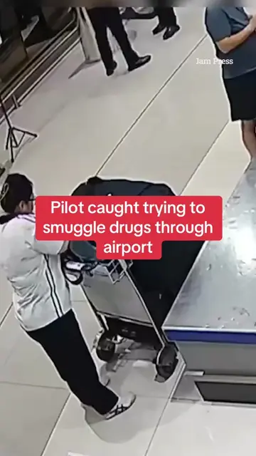 A pilot has been caught trying to smuggle 70,000 ecstacy pills through security.