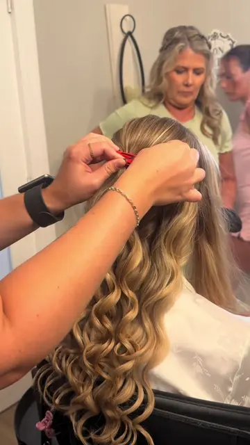 Watch how I pin this half up half down! The key is - pinning those second twists