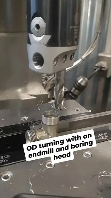 OD turning the threads off of this fitting, using an endmill in a boring head. A