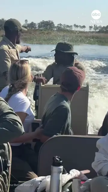 A tourist captured the heart-stopping moment her boat escaped a charging hippo i