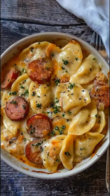 Cheesy, baked pierogi casserole loaded with savory smoked sausage, melted chedda