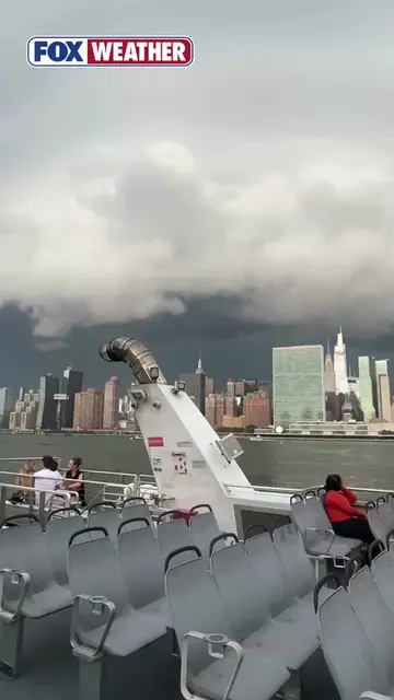 HURRY UP, CAPTAIN ⛈️: Passengers aboard a parked ferry were greeted by a menacin