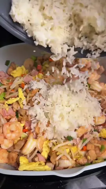 Easy homemade oriental fried rice loaded with juicy chicken, pork, shrimp, ham, 