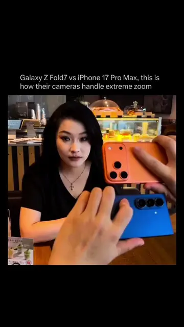 The Galaxy Z Fold7 and iPhone are pointed at the same subject in this side by si