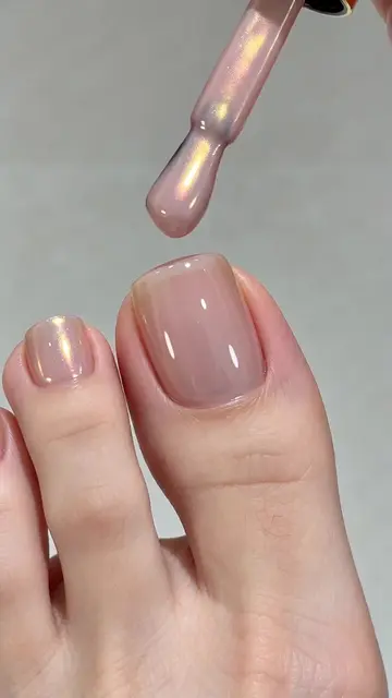 POV: Dreamy aurora shimmer pedicure, sheer nude base with golden pearlescent str