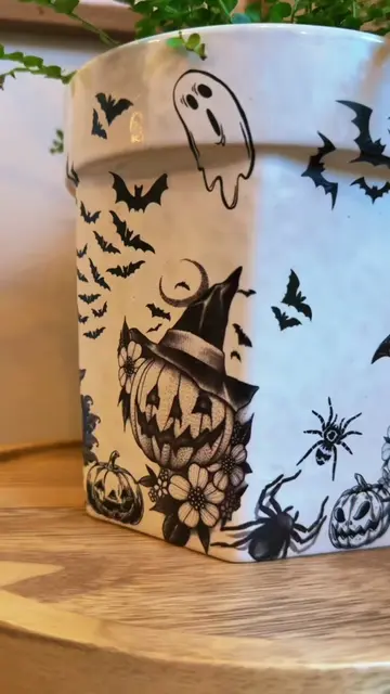 Halloween temporary tattoos and turned a simple white flower pot I already had i