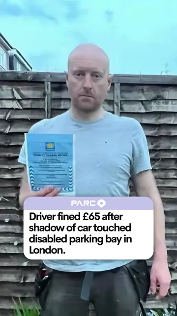 A driver was given a parking fine because the shadow of his car touched a disabl