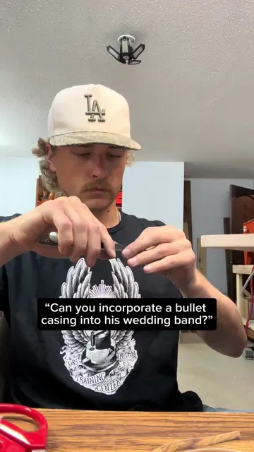 A 9mm bullet head inlaid into a handmade solid sterling silver wedding band, the