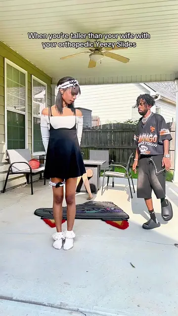 When you’re taller than your wife @Angel with your orthopedic Yeezy Slides 🦩🔥 