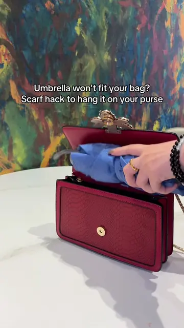 Umbrella won't fit in your bag? Watch this 👀 One scarf, one knot, and it rides 