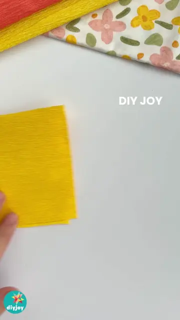 Here’s a marigold flower you can make from crepe paper without any complicated f