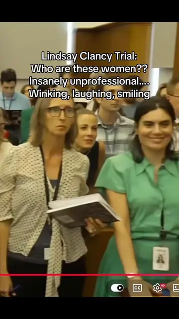 What in the world was so funny?? Why is the lady in the green dress winking?? An