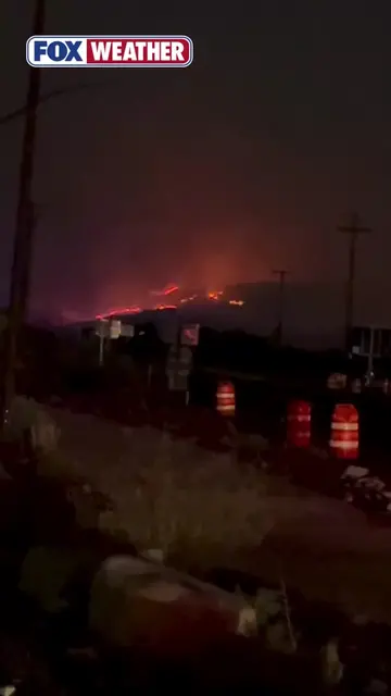 RAGING WILDFIRE 🔥: The rapidly growing Hawk Fire raged throughout the night, pr