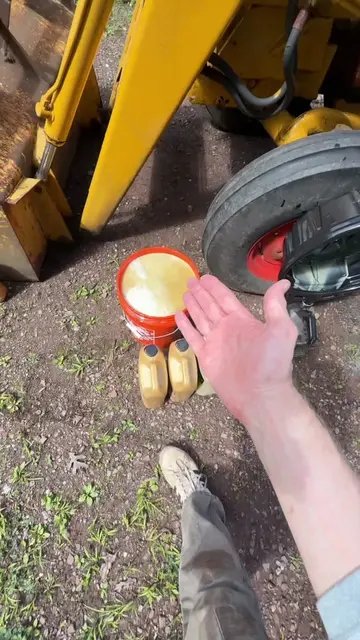 In part two of changing the hydraulic fluid in a 1967 International 2504 industr