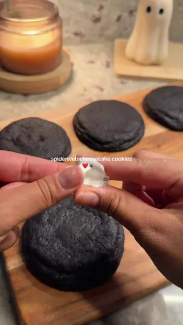 spiderweb cheesecake cookies 🕷️❤️   recipe: black chocolate cookie dough: 1 cup