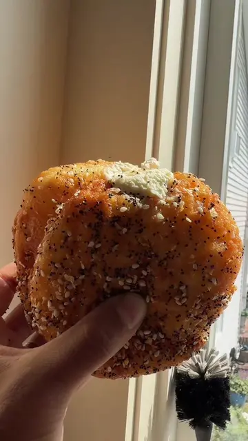 Dagel -sourdough,brioche donut filled with whipped cream cheese and covered in e