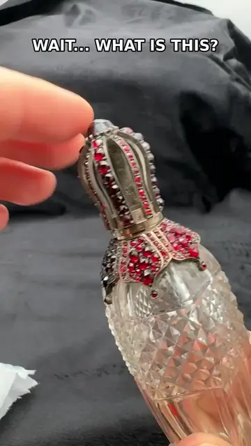 I was NOT expecting a garnet-covered crystal perfume bottle to come out of that 