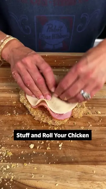 Baked Chicken Rollatini are elegant, breaded chicken rolls filled with ham and p