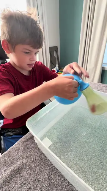 This is Griffin’s current OBSESSION! 🎈💦 A plastic water bottle + balloons = ho