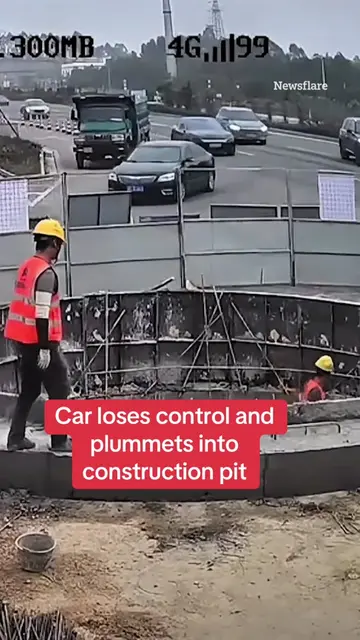 This is the shocking moment a car loses control and plummets into a construction