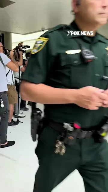 NEW: Tiger Woods emerges from court with Vanessa Trump by his side after accepti