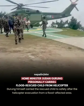 Home Minister Sudan Gurung was seen personally carrying a child rescued by helic