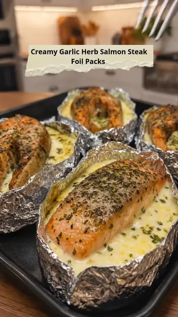 Creamy Garlic Herb Salmon Steak Foil Packs Tender salmon steaks baked in foil wi